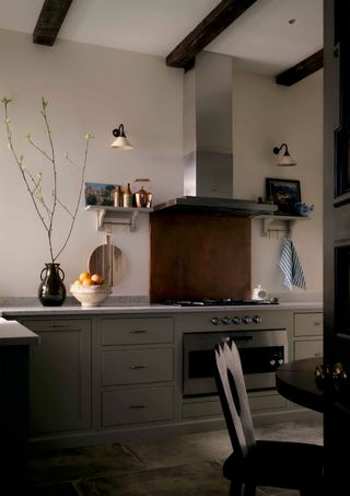 The kitchen of this Marylebone townhouse was extended during renovation to increase the room's height  the wooden beams...